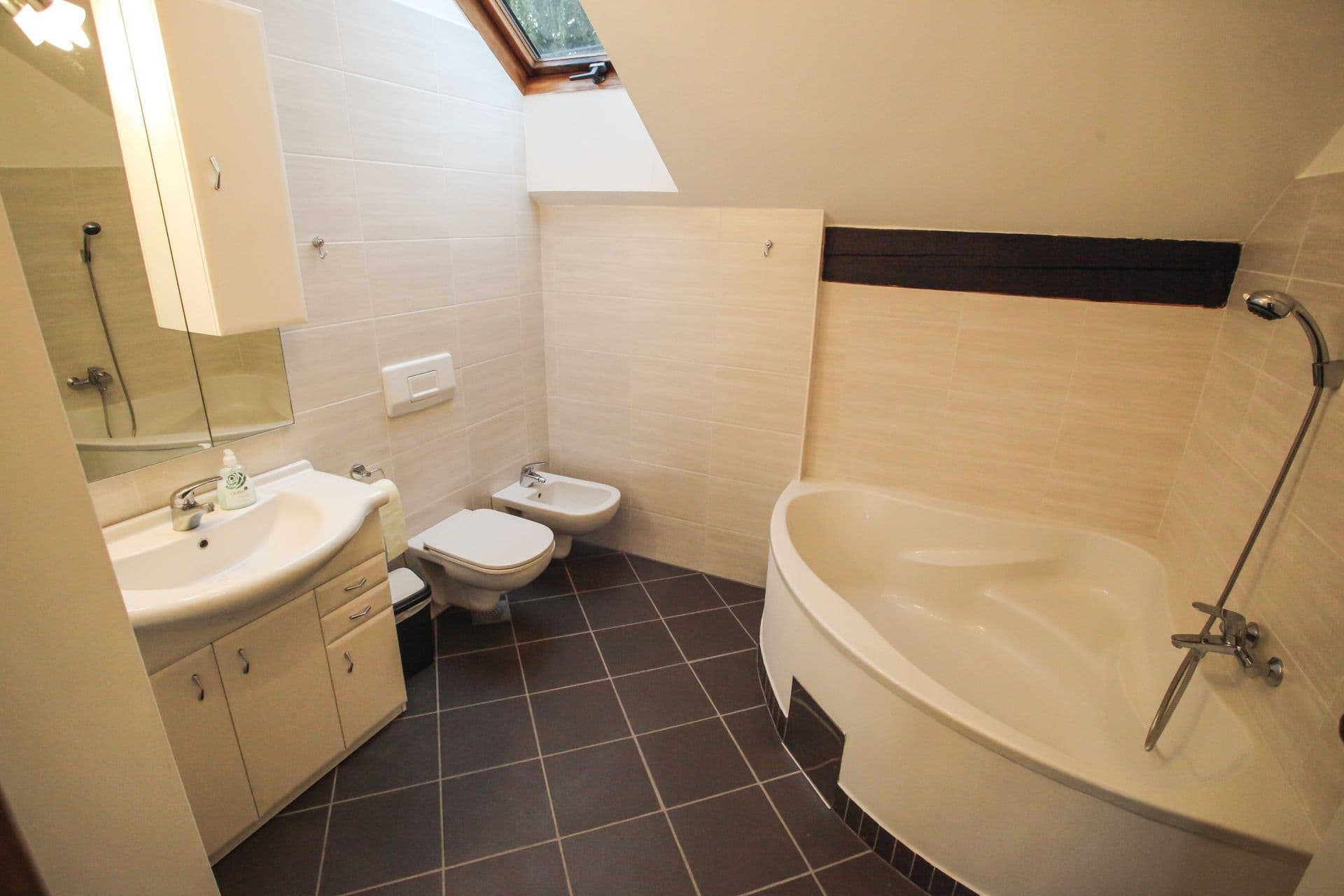 Modern fully equipped kitchen with dining area and contemporary appliances