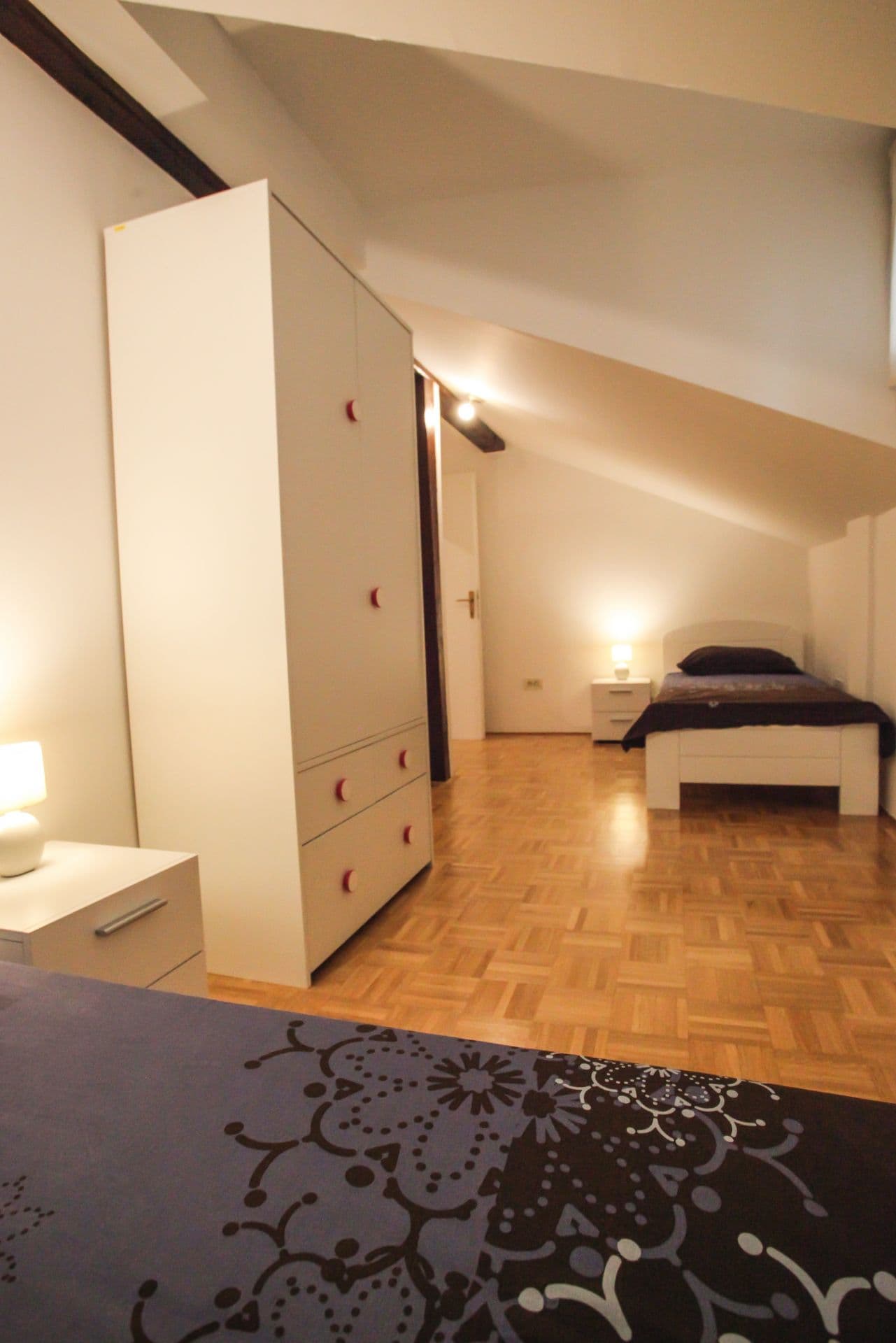 Second bedroom with comfortable sleeping arrangements and wardrobe storage